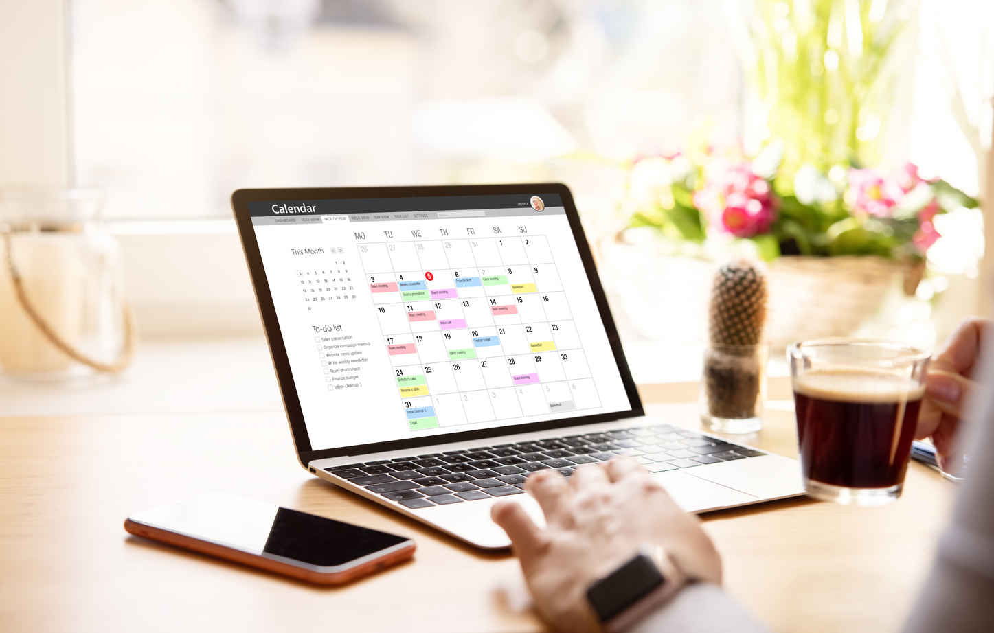 Woman Looking at Calendar on Laptop Computer